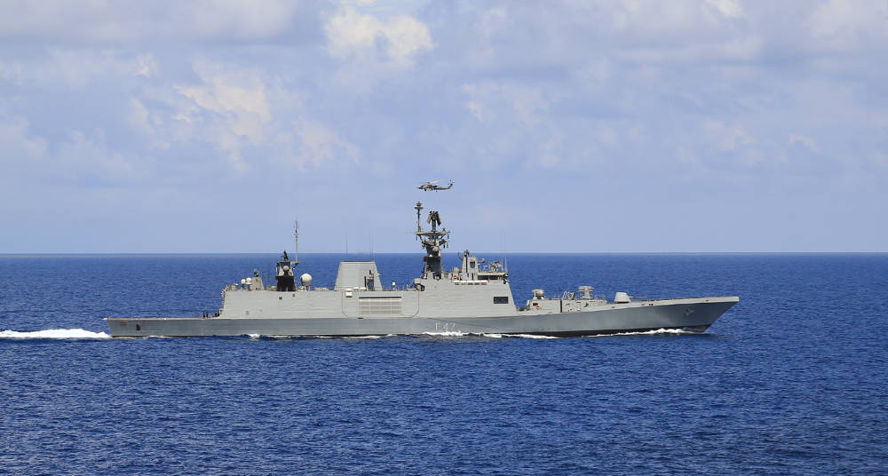 Indigenous stealth frigate INS Shivalik steams past the US Carrier during the ongoing Exercise Malabar-2015