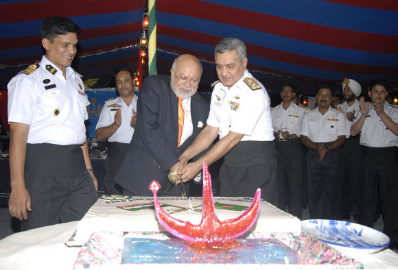 A cake celebrating Indo- Bangaladesh friendship being cut on board by His Excellency Mr Tariq Ahmad Karim, the High Commissioner of Bangladesh to India, Vice Admiral Satish Soni, Flag Officer Commanding in Chief Southern Naval Command and Captain Mir Ershad Ali, Commanding Officer of BNS Bangabandhu